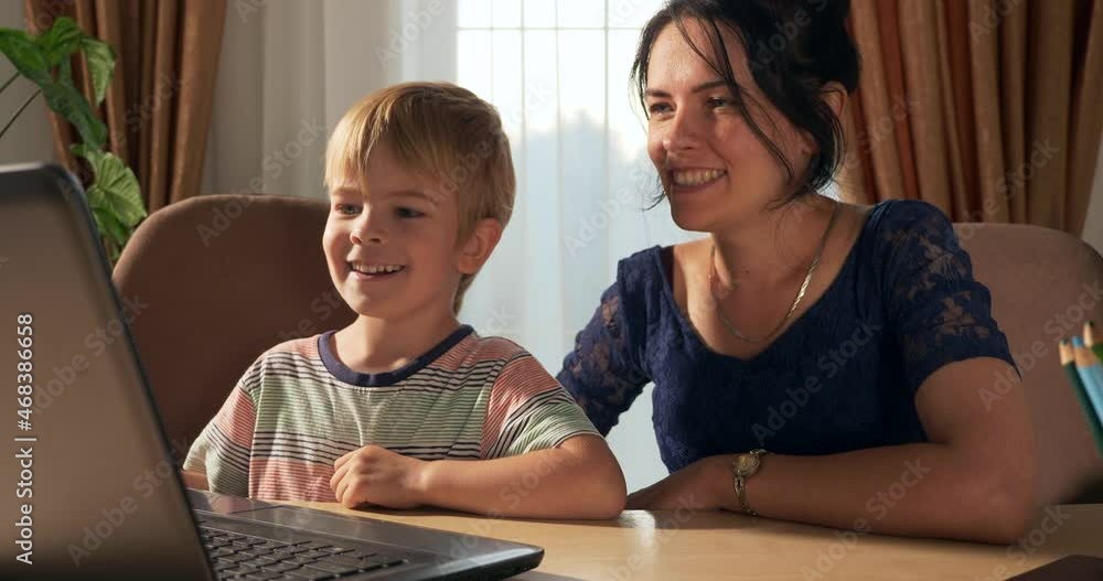 Mother Teach Child Study Online Using Laptop Computer. Little Boy Distance Learning at Home. Preschooler Kid Sits at Desk Table in Room Near Window 4K Mother Teach Child Study Online Using Laptop Computer. Little Boy Distance Learning at Home. Preschooler Kid Sits at Desk Table in Room Near Window 4K