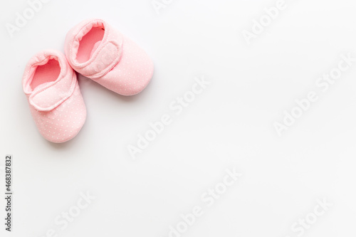 Baby girl pink newborn booties - babyshower party background