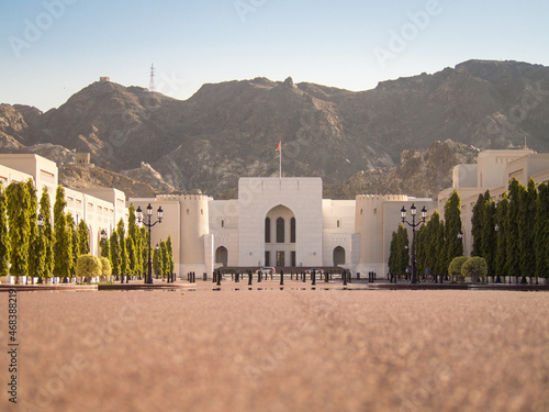 View of the National museum of Oman in Muscat with mountains on the background during the day.