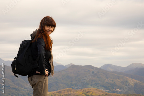  Pretty middle aged woman on top of a mountain in autumn