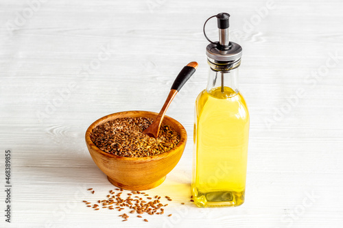 Sesame oil in glass bottle with sesame seeds. Extra virgin oil for food or cosmetic products