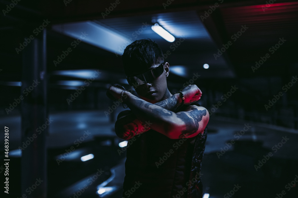 Cyberpunk style. Tattooed guy in one city. Cyber glasses. Cyberpunk style. Tattooed guy in one city. Cyber glasses.