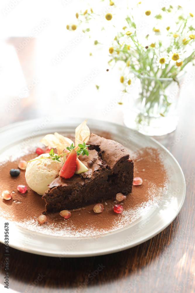 Chocolate cake with ice cream dessert on wood table Chocolate cake with ice cream dessert on wood table