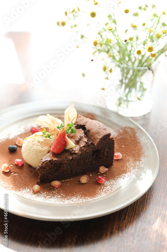 Chocolate cake with ice cream dessert on wood table