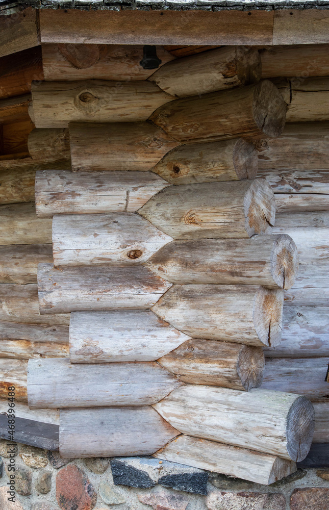 Warm corner of a log wooden blockhouse, close-up. Wooden house construction, architecture