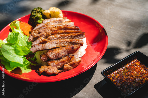 Thai style grilled pork with rice and vegetable, meal meat for dinner or lunch main dishes