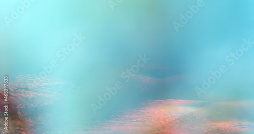Abstract flow holographic neon background in blue and turquoise colors with cloudy texture and marbled details. soft gradients with light fog or hazy lighting. cloudy sky with pastel gradient color.