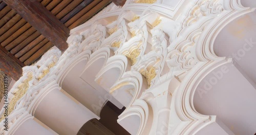 ZARAGOZA, SPAIN - Oct 27, 2021: Zaragoza, Aragon, Spain - October 2021. Ornamental Arch With Arabesque Design In Moorish-Taifa Hall Of Aljaferia Palace. low angle, panning 4k photo