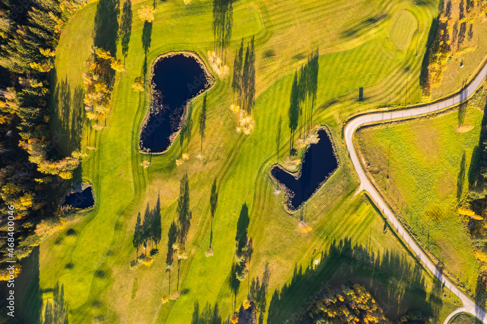 Fototapeta premium Aerial autumn fall sunny day view of golf course field