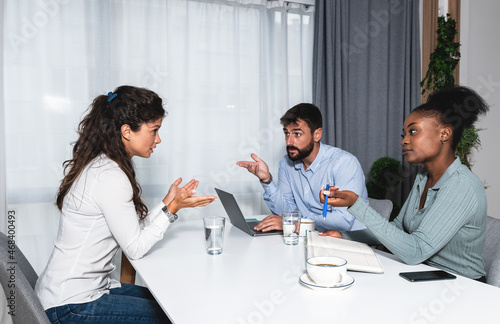 Photography Three young experts business people having a meeting and discussion around the d