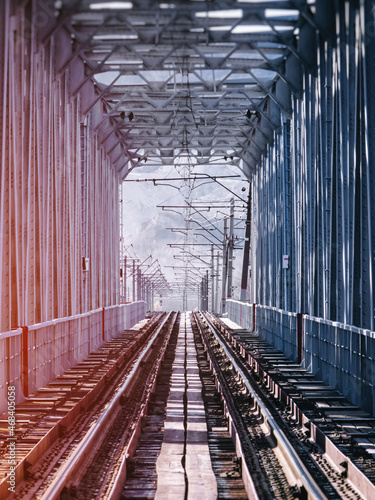Fototapeta Naklejka Na Ścianę i Meble -  Railroad bridge made of metal girders.