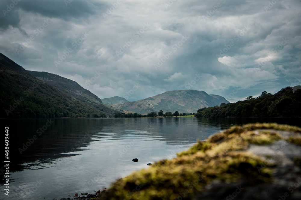 A landscape photograph looking over the waters of Buttermere and over to the northern fells of Buttermere Valley in the Lake District, Cumbria.