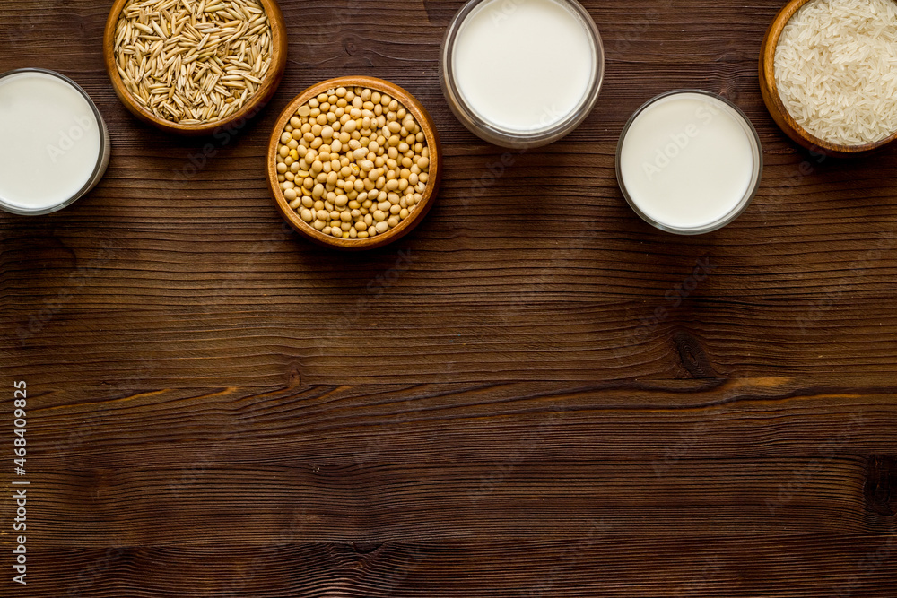 Non dairy vegan milk with ingredients almonds rice and oats Stock Non dairy vegan milk with ingredients almonds rice and oats Stock