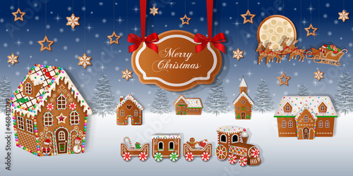 Merry christmas background with gingerbread cookies on snowy landscape