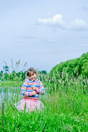girl sitting on the grass