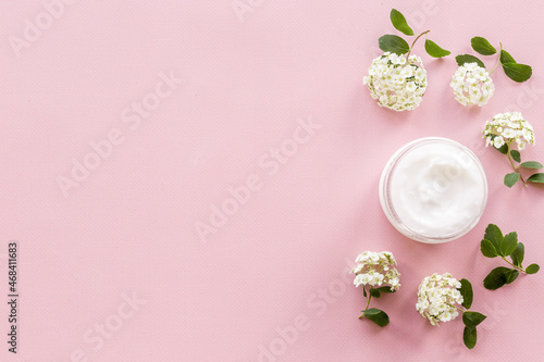 Herbal facial cream cosmetic for skin care with white flowers