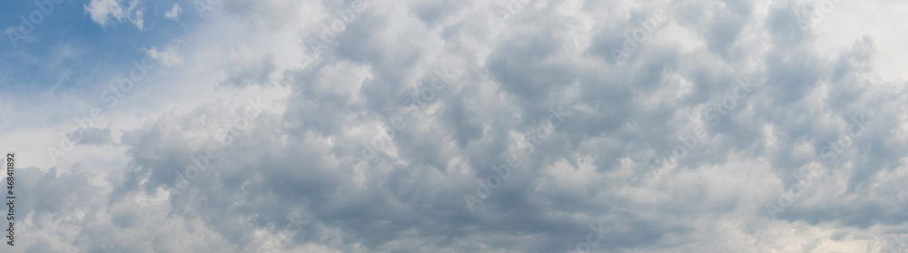 White curly textured cloud on blue sky