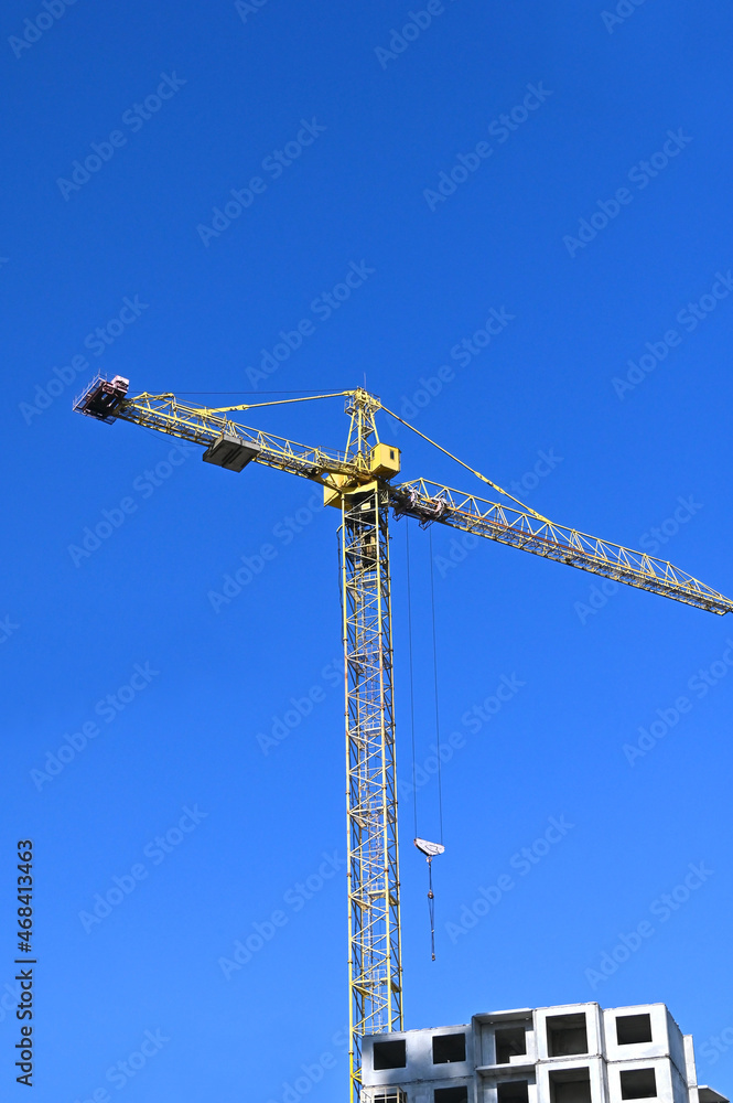 Crane and highrise construction site Crane and highrise construction site