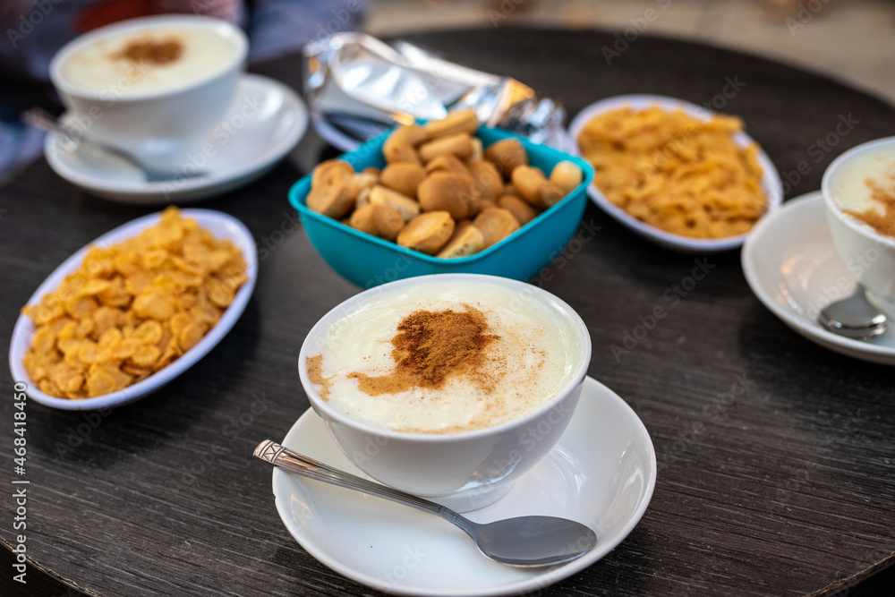 A cup of traditional Lebanese desert known as Sahlab with its usual side dishes A cup of traditional Lebanese desert known as Sahlab with its usual side dishes