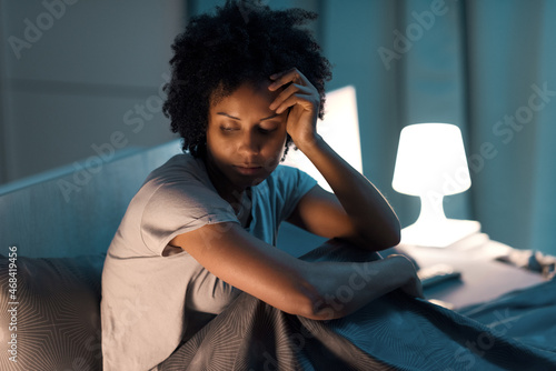 Young stressed woman suffering from insomnia photo