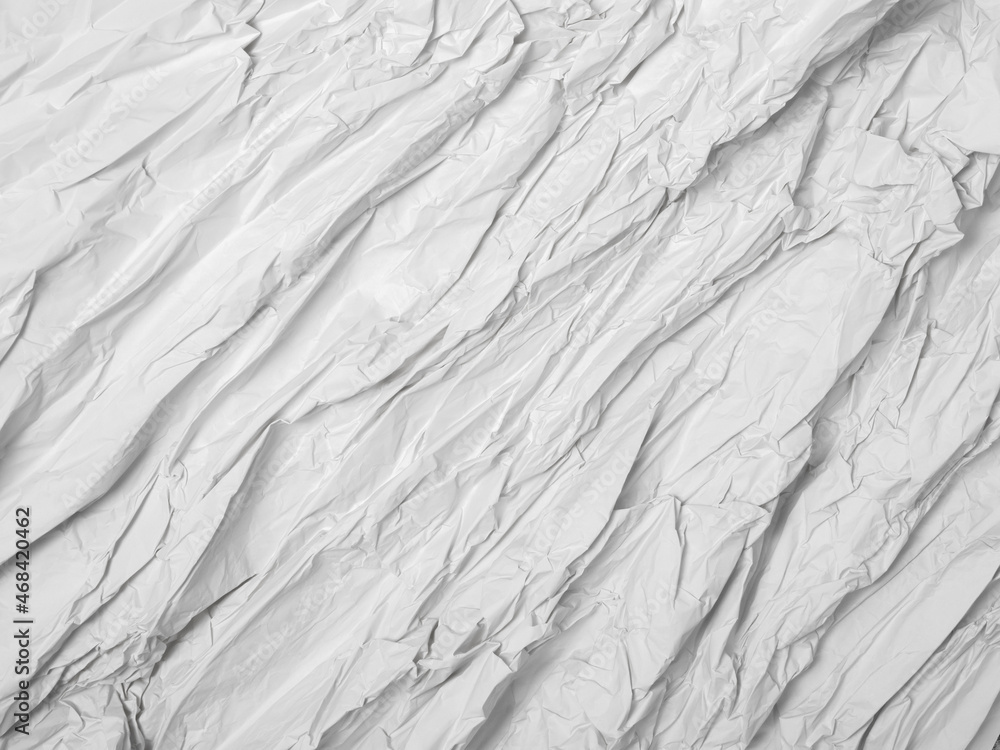Crumpled white paper backround texture. Conceptual texture with parallel diagonal lines Crumpled white paper backround texture. Conceptual texture with parallel diagonal lines