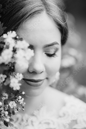 bride with a wedding bouquet in the forest