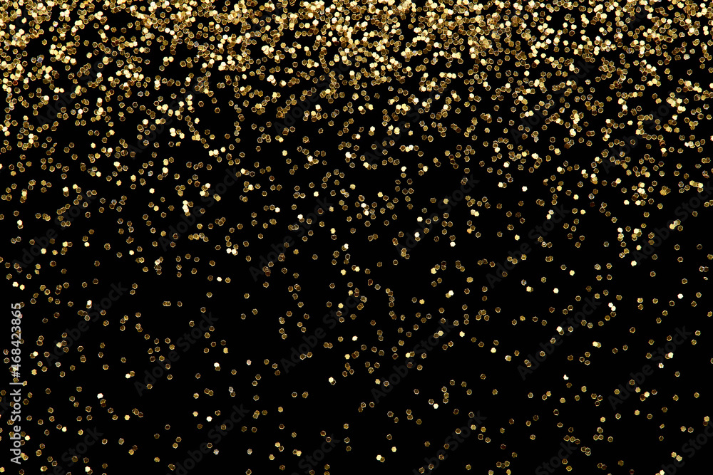 Falling golden glitter confetti background, luxury New Year party celebration.