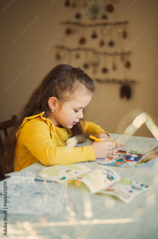 Cute little girl writes a letter to Santa Claus. Christmas concept Cute little girl writes a letter to Santa Claus. Christmas concept