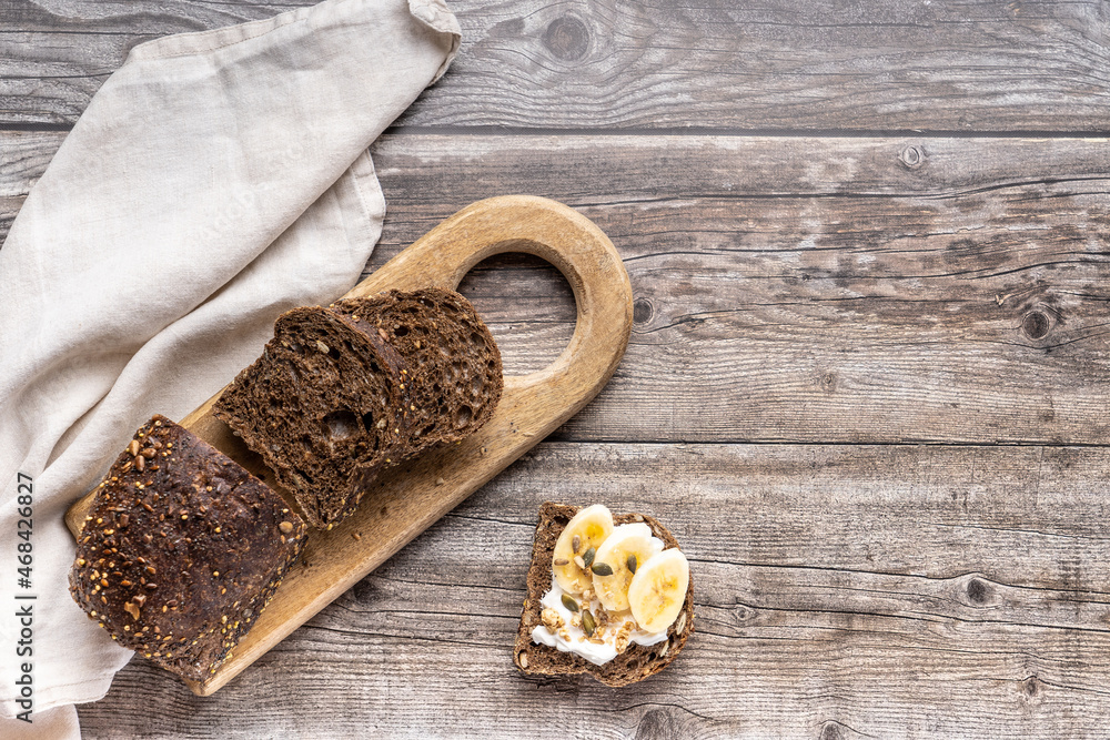 A table for a healthy breakfast with rye whole-grain bread, butter. Top view. A table for a healthy breakfast with rye whole-grain bread, butter. Top view.