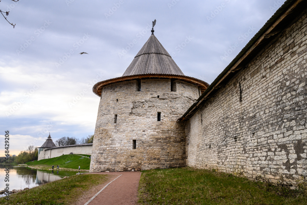 Flat and High towers. Historic site in Pskov. Fortress wall. Pskov Krom. It is a nasty day.
