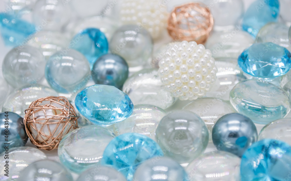 Beautiful background of transparent, light blue glass beads, crystals and white pearls. Copy space Beautiful background of transparent, light blue glass beads, crystals and white pearls. Copy space