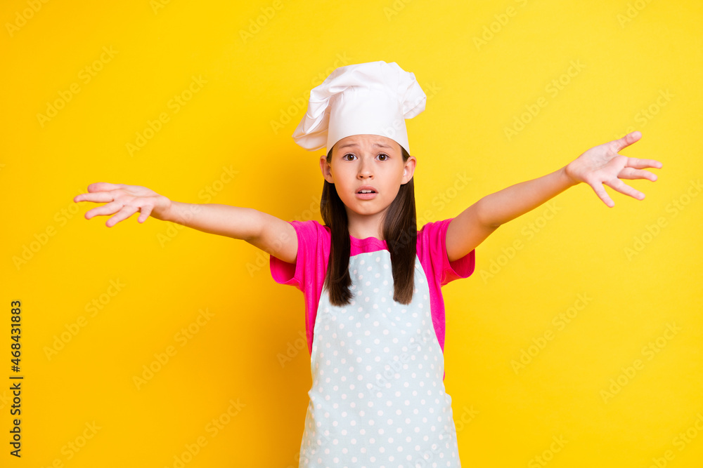 Photo of helpless troubled desperate girl plead assistance wear white apron hat isolated yellow color background Photo of helpless troubled desperate girl plead assistance wear white apron hat isolated yellow color background