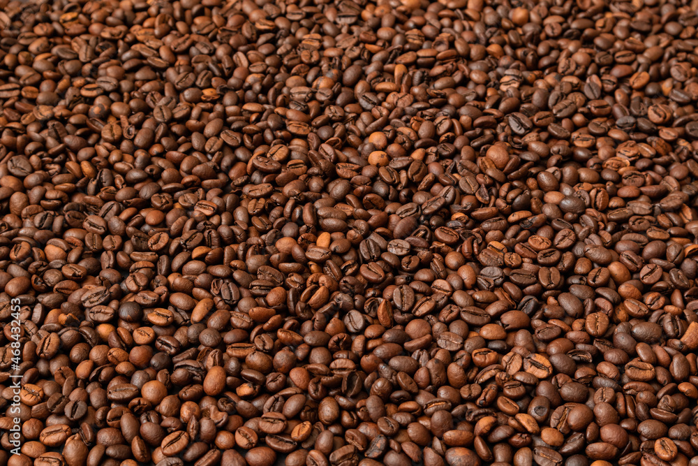 Fresh roasted coffee beans background. Selective focus. Copy space Fresh roasted coffee beans background. Selective focus. Copy space