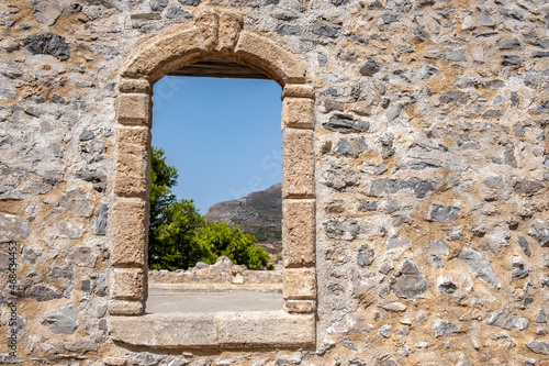 Window frame with arch on a stone wall at Venetian Castle Fortezza at Chora Kythira island  Greece.