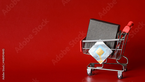 Fotografie Supermarket trolley with black box and RFID tag transponder