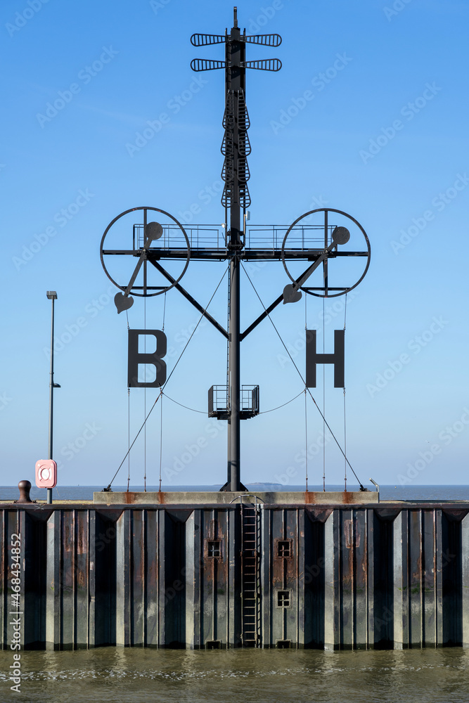 Wind semaphore in Bremerhaven, Germany. The almost 20 m tall mast shows the  wind force and wind direction of Borkum and Heligoland. Stock Photo | Adobe  Stock