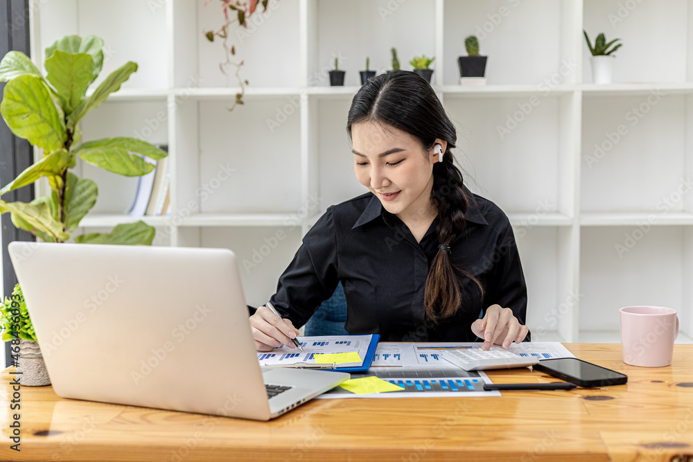 A business finance woman is reviewing a company's financial documents prepared by the Finance Department for a meeting with business partners. Concept of validating the accuracy of financial numbers. A business finance woman is reviewing a company's financial documents prepared by the Finance Department for a meeting with business partners. Concept of validating the accuracy of financial numbers.