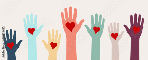 Raising hands with heart shape , donation and volunteers work concept photo