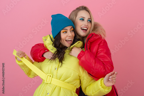 pretty women friends in colorful coat