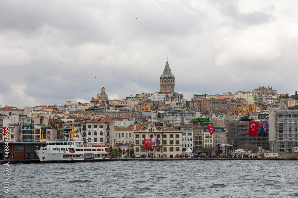 The Galata tower and the old quarters of Istanbul on the background of blue sky.  Tourist destination Istanbul Turkey