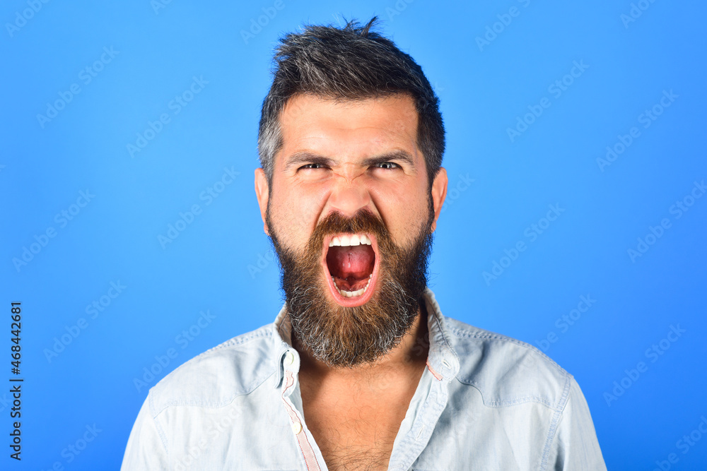 Angry man. Anger. Aggressive bearded man screaming. Man with long beard and mustache with angry face expression. Feeling and emotions. Close Up. Emotions. Feelings. Facial expressions concept. Angry man. Anger. Aggressive bearded man screaming. Man with long beard and mustache with angry face expression. Feeling and emotions. Close Up. Emotions. Feelings. Facial expressions concept.