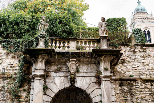 Statues of angels on the balcony near Palazzo Terzi. Bergamo, Italy