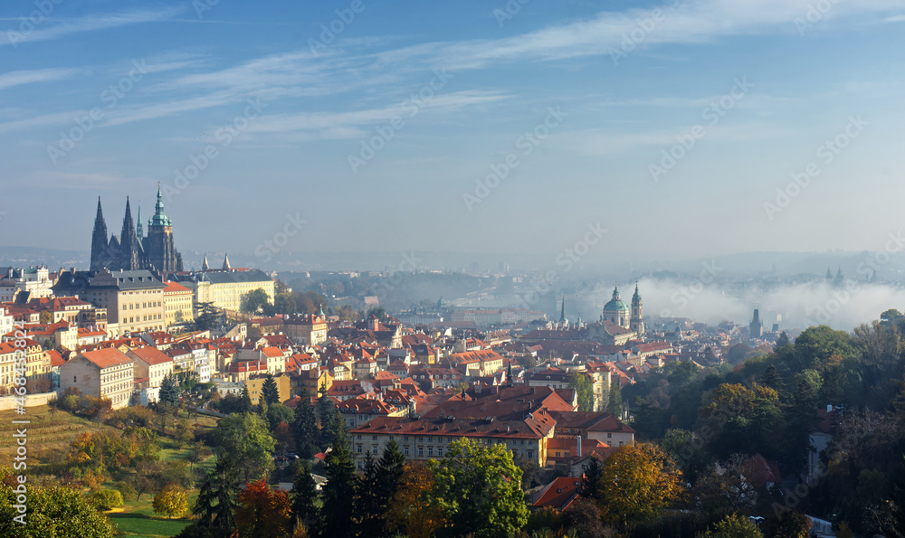 Old Town of Prague with the Lesser Quarter and the river shrouded in fog on a sunny autumn day. Old Town of Prague with the Lesser Quarter and the river shrouded in fog on a sunny autumn day.