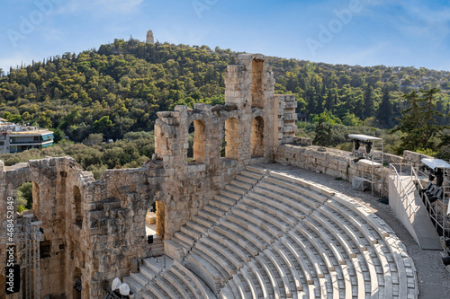 Ιnterior view to the Odeon of Herodes Atticus (Herodion) greek ancient theater as seen from the archaeological site of Acropolis. Filopappou hill in the background
