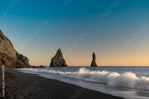 Wallpaper Mural Iceland Reynisdrangar rock formation in the sea with sunset and ocean waves on the beach Torontodigital.ca