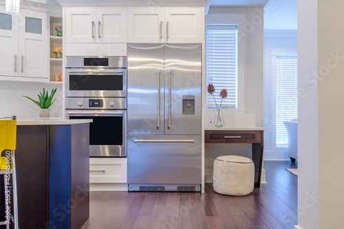 Tablou pe pânză Modern, bright, clean, kitchen interior with stainless steel appliances in a lux