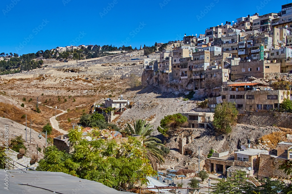 view from the city of David to the old Jewish cemetery and Silwan or Siloam is arab neighborhood in East Jerusalem, on outskirts of Old City of Jerusalem, Israel
