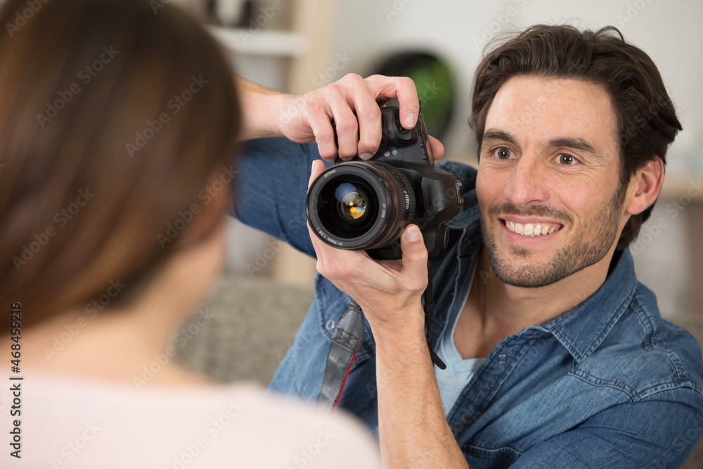 Fototapeta premium photographer and model working in modern lighting studio