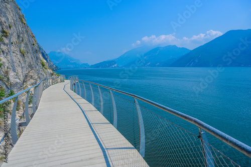  Ciclopista del Garda  - Bicycle road and foot path over Garda lake with beautiful landscape scenery at Limone Sul Garda - travel destination in Brescia  Italy