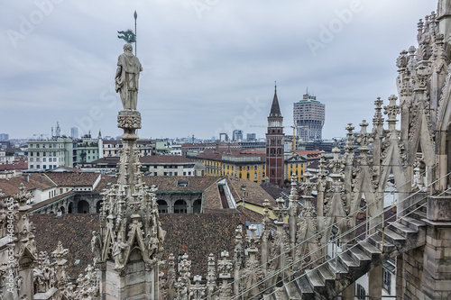 Spires on roof top of Milan Cathedral. Milan Cathedral (Duomo di Milano) dedicated to St Mary of the Nativity, with Gothic and Lombard Romanesque style. MILAN, ITALY.  © dbrnjhrj